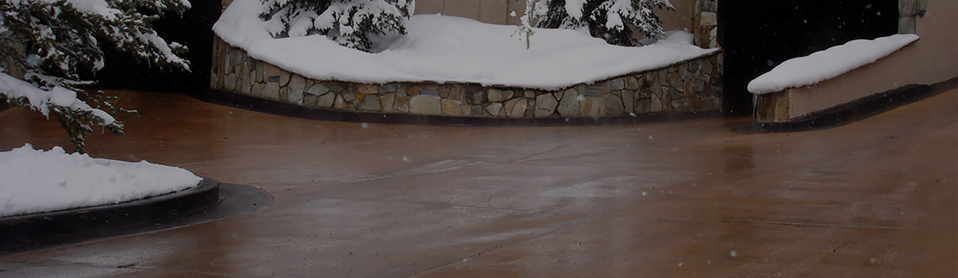 Heated concrete driveway after snowstorm banner